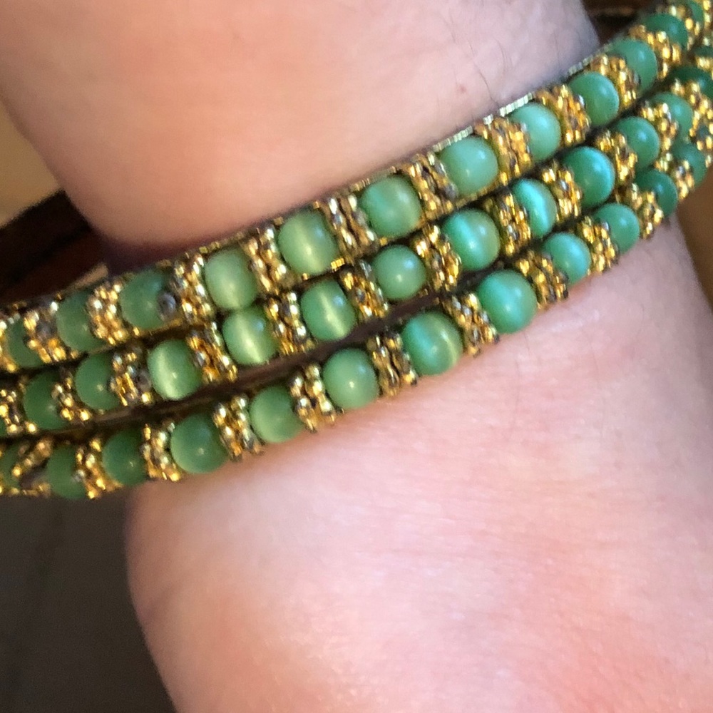 Set of green beaded metal bangles